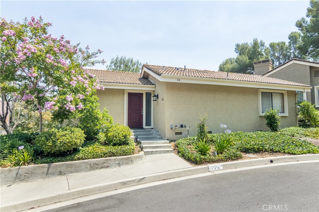 A beautifully maintained 3-bedroom, 2-bathroom home is available for rent in the desirable Oak Park neighborhood, just a short walk from excellent schools. This spacious two-story home features a high-ceilinged first floor with a primary bedroom and en-suite bathroom, a convenient laundry closet, a large living room with a cozy gas fireplace, and a dining area located just off the kitchen. The kitchen is equipped with sleek stainless steel appliances and offers ample cabinet space. A large balcony extends from the dining and living areas, perfect for outdoor relaxation or entertaining. Downstairs, the second level includes two additional bedrooms, a full bathroom, and another spacious balcony offering a beautiful view. Additional highlights include a community pool , detached two-car garage and a layout that combines comfort, function, and charm in a prime location.