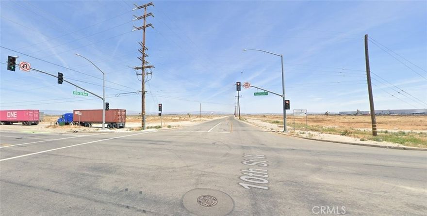 The address is approximately 46135 10th St W, Lancaster, CA 93534

The subject property is 9.85+- acres of light industrial property with 320+- feet of paved road frontage on 10th St W. Electricity, water, and sewer is on front of the property on 10th St W.  The potential of this property is astronomical.  Some of the commercial uses in the industrial zone areas are but not limited to: Aircraft-Related Uses, Automobile boat, vehicle, tractor dealerships, body repair, building trades, communication facilities, food manufacturing and storage facilities, general manufacturing, high technology research and development, warehousing and storage, emergency shelters etc.  Please see the zoning document or the broker can send you a copy of the allowed uses in the light industrial area. 

This is also near major employers in the Antelope Valley such as NASA, Boeing McDonnell Douglas, Virgin Galactic, Mojave Air and Space Port, Lockheed Martin, Northrop Grumman, BAE Systems, EM Aero Space, Palmdale Regional, BYD Electric Bus Terminal, AV Fair Event Center, the Antelope Valley College, West Wind Computer Science Magnet School, etc.

Directions: From the gas station at 45689 10th St W, Lancaster, CA 93534, start at the corner of W Avenue H and 10th St W and go north on 10th St W for 955 feet .18 of a mile and the lot is on the west side of the street. You will be at the southeast corner.

The GPS coordinates are (please enter these in the address section of maps in your smart phone and it will take you to the locations):

NW front: 34.722129, -118.148645
SW front: 34.721248, -118.148635
NW rear: 34.722271, -118.152819
SW rear: 34.721345, -118.152819