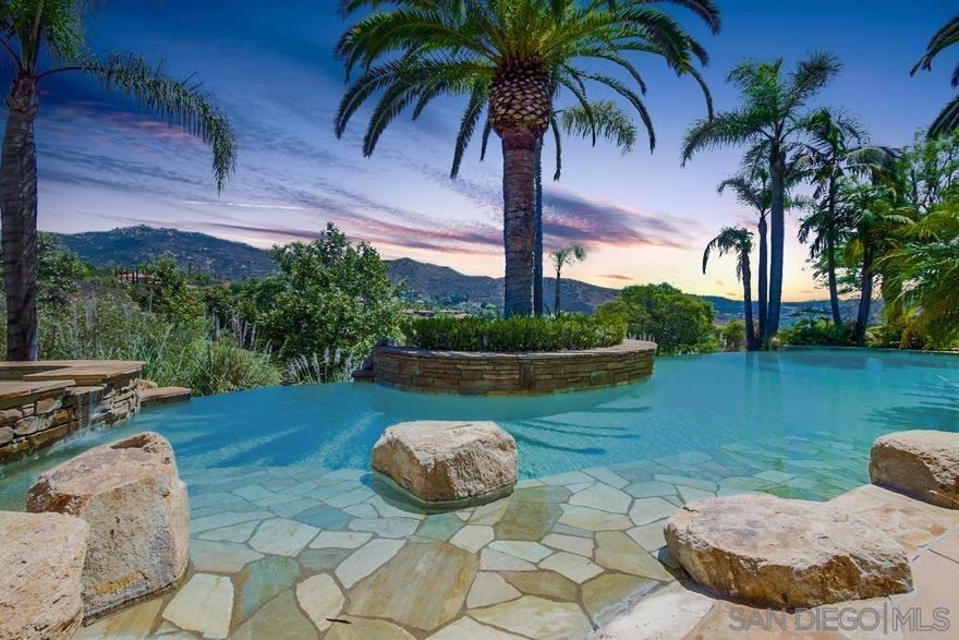 Experience the epitome of luxury living in the prestigious, guard-gated community of The Heritage. This custom-built, resort-style estate by renowned builder Greg Agee embodies unmatched elegance and sophistication. Overlooking panoramic golf course views, this Tuscan-inspired masterpiece is meticulously designed with exceptional attention to detail.