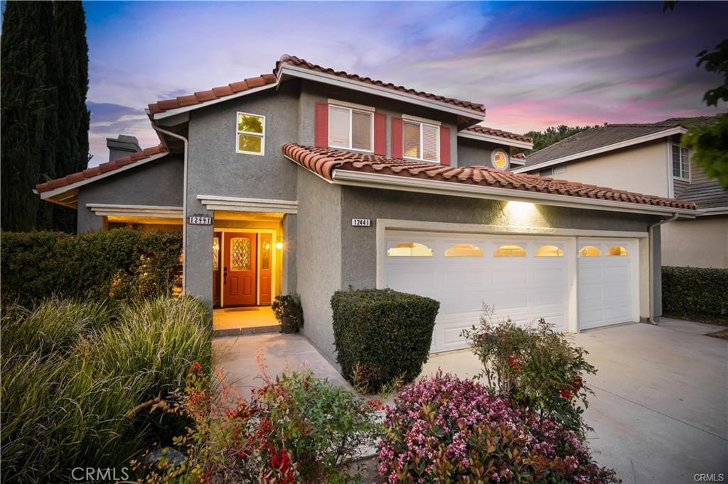 Welcome to this stunning home located on a quiet & family friendly cul-de-sac. Beautiful curb appeal with charming courtyard complete w/upgraded French doors & a gorgeous, custom front door w/beveled glass panels. As you walk in, you are welcomed by soaring ceilings, an open & inviting floorplan & a stunning, custom wrought iron & wood staircase. The spacious formal living room complete w/a beautifully upgraded fireplace opens to the formal dining room. Downstairs you will also find a large bedroom & remodeled bathroom. Gourmet kitchen w/custom cabinetry, stone counter tops & glass tile backsplash, stainless steel appliances, upgraded lighting, breakfast bar & nook. Spacious family room complete w/fireplace & slider to the backyard. Upstairs you will find an oversized primary suite & primary bathroom w/dual sinks, custom cabinetry, granite counters, a large tub & separate walk-in shower. Additionally, you will find two spacious, secondary bedrooms which share a remodeled Jack-n-Jill bathroom. Some of the many upgrades include: newer HVAC systems, newer dual paned windows & slider, newer water heater & more! Pool size professionally designed & landscaped backyard, just like in a "Better Homes & Gardens" magazine! Large covered patio w/lighting, drought tolerant landscaping, walkways, firepit, dual, built-in bar area w/sink. This yard will take your breath away: perfect for relaxing or entertaining!