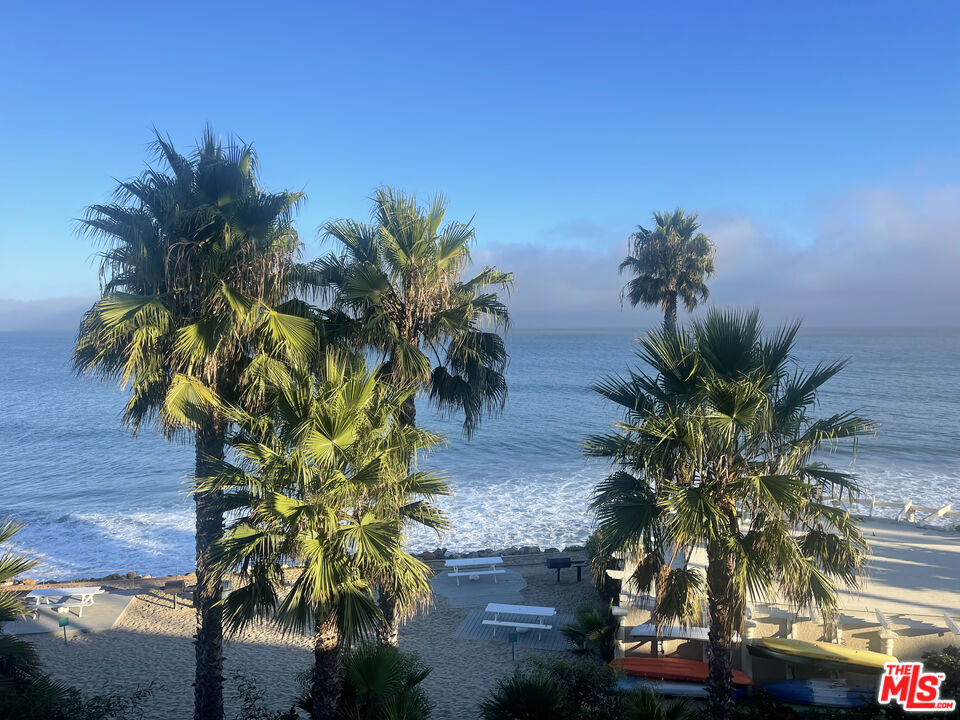 Stunning ocean views from this beautifully remodeled two bedroom, two bath condo. Cozy fireplace in living room, large balcony, private 2 car garage. Resort style living with tennis, gym, heated pool, spa, sauna and beach BBQ's! Live the dream!