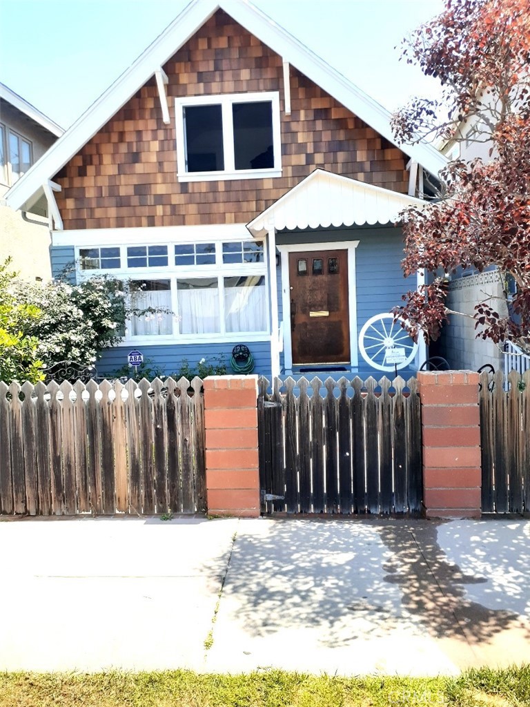 FURNISHED! Electricity, Wifi, Basic Cable, Water & Trash INCLUDED!! This historic front house is across the street from the beach and a short stroll to the Main Street restaurants & shops. Featuring two stories, hardwood floors, 3 bedrooms, 1.5 updated bathrooms, a gas fireplace, a fully equipped kitchen, two patios, common laundry room and a one car garage space. .
