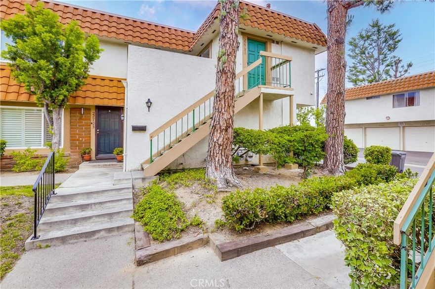 Prepare to fall in love with this newly updated and improved single level carriage end unit with gorgeous new upgrades throughout! Ideally situated in the Rancho Viejo Condos community within walking distance of local schools, dining, shopping, and recreation. The vibrant front door welcomes you to the home. Step inside and soak in the light filled freshly painted interior with scraped ceilings, new door hardware throughout, new custom light fixtures, new baseboards, and new luxury vinyl plank flooring throughout the well-designed open concept floor plan, all setting the stage for an ideal living environment. The light-filled dining area is open to the spacious living room with direct access to the balcony patio creating a superb indoor-outdoor living space. The sparkling Kitchen boasts timeless white cabinetry, new Stainless-Steel appliances, new updated hardware, new kitchen sink faucet, and a laundry closet with shelving and hookups for full size washer and gas dryer. 2 spacious and light-filled bedrooms with new mirrored closet doors and a beautifully updated bathroom with new vanity, new faucets, new fixtures, framed vanity mirror, new toilet, and a newly reglazed shower and tub. The sunny balcony patio is the perfect space for relaxing and entertaining with friends and family. Home includes a 1 Car garage and 1 assigned parking space 8D. Community guest parking spaces nearby. This home is conveniently located just steps away from the community pool area and basketball courts. Close to local parks, schools, Orchard Shopping Center, easy 5 Frwy access, and just minutes from local beaches!