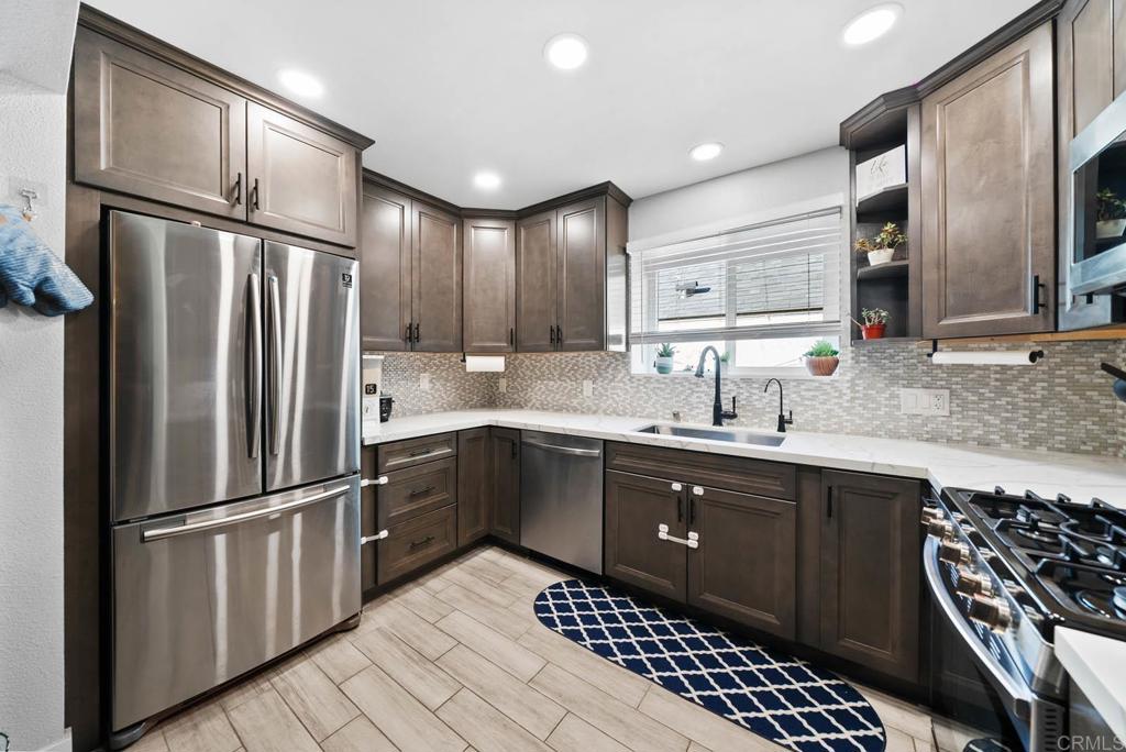 VA/FHA Approved – Discover your dream home in the heart of San Diego! This 3-bedroom, 3-bath property offers 1,352 sq. ft. of thoughtfully designed living space. With two master bedrooms featuring private en-suite bathrooms and a main-level bedroom ideal for guests or an office, this home provides comfort and flexibility for any lifestyle. Modern upgrades include paid-off solar, a new washer and dryer, and professionally designed landscaping, all with low HOA fees for added value. Located less than 15 minutes from downtown San Diego and military bases, this home is close to shopping, dining, schools, and entertainment. Schedule your private showing today!