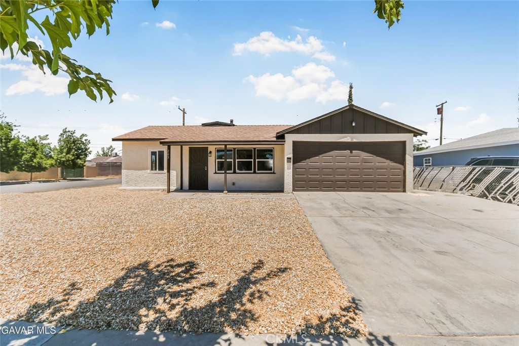 This beautifully renovated corner-lot home has been treated to a full interior and exterior paint refresh, giving it a clean, modern look inside and out. Step into the heart of the home and you'll find a stylish kitchen featuring gleaming granite countertops, freshly painted cabinets, a brand new stainless steel stove and dishwasher, a stainless steel undermount sink with a new faucet, recessed lighting, and a sleek drop-down hood that ties it all together. Brand new plank flooring runs throughout the entire property, creating a seamless and updated feel in every room. The bathroom has been thoughtfully updated as well, with a new vanity and toilet, custom tile shower surround, freshly glazed tub, new lights, and upgraded plumbing fixtures, all adding to the move-in ready appeal. Out front, you'll love the crisp new rock landscaping that provides curb appeal with low maintenance, while the backyard offers a spacious covered patio that's perfect for relaxing or entertaining. There's also a custom gate with RV access along the side of the property—great for extra vehicles or trailers. The dual pane vinyl windows throughout add energy efficiency and natural light, and the brand new roof adds peace of mind. All of this is located on a corner lot with a 2-car garage and indoor laundry area, making daily living convenient and practical. The home is equipped with a mini-split system for both heating and cooling, ensuring year-round comfort. Located in a desirable area, close to shopping, dining, and schools, this is a rare offering you don't want to miss—come see this move-in ready beauty today!