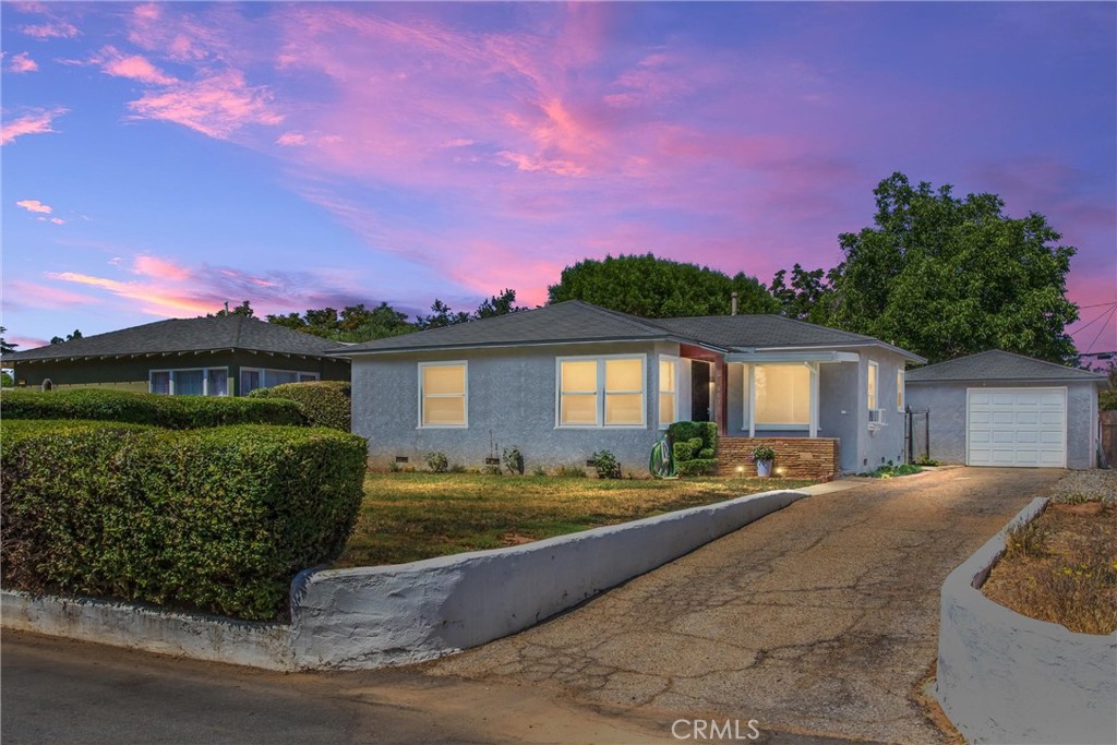 Charming 1950's home with plenty of original charm, located in a great neighborhood, right across from the future revitalized Stuart Park project. Enjoy the view of the park from the newer double-pane windows. This home has original hardwood floors under the carpet. Two bedrooms with ceiling fans & walk-in closets. One bath with built in linen cabinet and additional built in cabinet in the hallway. The kitchen has updated quartz counter tops, tile floor, gas stove and fridge. There is a dining area with ceiling fan and it still has the built-in mail slot, so mail is safely deposited inside. Off the kitchen is a laundry room that includes washer/gas dryer and the original built-in ironing board. A convenient back door accesses the covered back patio & large back yard. The covered patio leads to the detached garage with a 3/4 bath with shower, which is great for cleaning up after yard work. The back yard is large enough for a possible ADU, pool, workshop, shed, etc. (check with the City of Beaumont). The backyard has alley access making these possible additions easier. There is plenty of room for a garden in addition to the existing Walnut, Grapefruit Tangelo and Loquat trees.