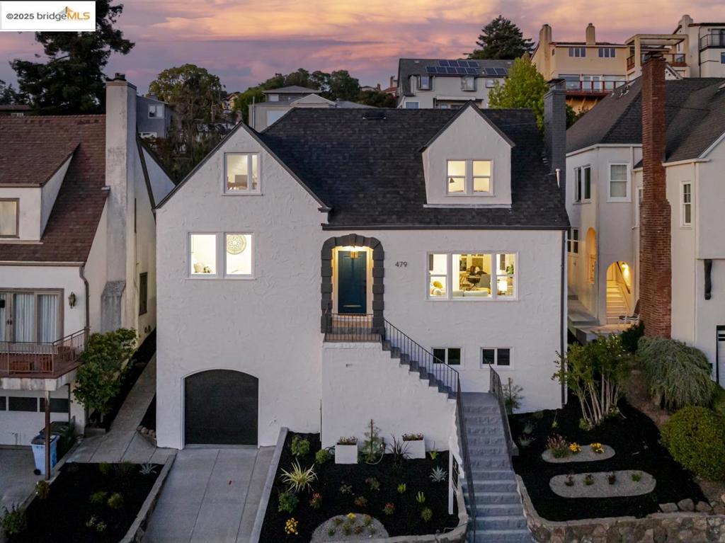 Stunning and fully remodeled, this 3-bed, 2-bath Cragmont gem spans 1,784 sq ft and offers an extraordinary lifestyle defined by sweeping Bay views, timeless charm, and high-end finishes. Step onto the front porch and take in direct views of the Golden Gate Bridge, Angel Island, and the San Francisco skyline. Inside, natural light fills the living room anchored by a cozy fireplace and newly updated flooring. The open-concept kitchen features new stainless steel appliances, a gas range, a peninsula with bar seating, a breakfast nook, and a dining area—all with postcard-worthy vistas. Two main-level bedrooms include one with Golden Gate views and dual closets, plus a garden-facing rear room. The updated hall bath features modern finishes. Upstairs, the primary suite offers a peaceful retreat with San Francisco skyline views, a walk-in closet, and an en suite bath with a navy vanity. A few steps up is a bonus room perfect for an office or guest space with panoramic bridge views. The expansive terraced backyard offers multiple outdoor areas, and the home includes a tandem garage, off-street parking, and a tastefully landscaped front yard. This is more than a home—it’s a private observatory over the Bay, nestled in a quiet, creative, and coveted Berkeley neighborhood.