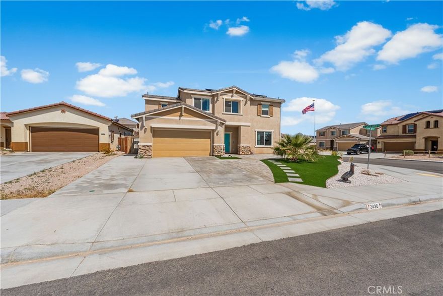 Welcome to this move-in-ready corner-lot gem in Rosamond, built in 2021 and still radiating that fresh, new-home feel. This thoughtfully upgraded two-story home features 20 solar panels, a tankless water heater, EV-ready hookups, durable rigid vinyl plank flooring, rain gutters, and two 10x10 Tuff Sheds for extra storage. The professionally landscaped front and back yards include a low-maintenance Trex deck—ideal for relaxing or entertaining. Inside, the open-concept layout offers a bright family room that flows into the dining area and kitchen, complete with granite countertops, ample cabinetry, a large picture window, and sliding doors to the backyard. Downstairs also includes a flexible bonus room and powder bath. Upstairs, you'll find a laundry room and four spacious bedrooms, including an oversized main suite with dual sinks, a soaking tub, separate shower, and private water closet. With a two-car garage and modern upgrades throughout, this home is truly a standout, don't miss out!