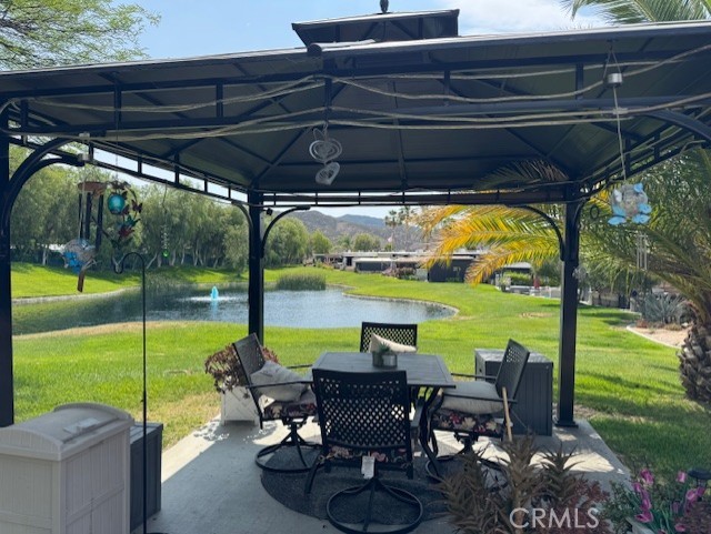 Amazing Sunset and Pond Views from a perfect platform under Gazebo. Only 2 properties down from Pool 4 with bathhouse and Laundry. Privacy hedges on both sides of lot and great curb appeal with golf cart parking and lots of room for your vehicles. Image sitting under the gazebo taking in this view. You will love it here. Financing Available…