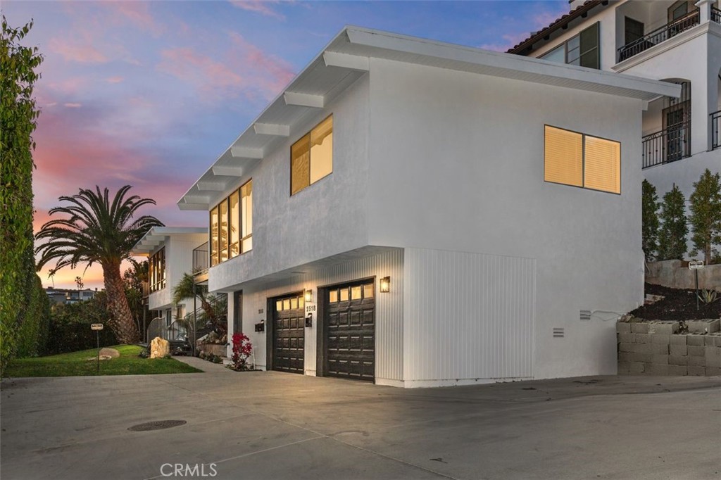 Rare Coastal Investment & Dream Build Opportunity in Corona del Mar
Perched above Bayside Drive with harbor and ocean views, this rare multi-unit income property offers endless possibilities in one of Coastal Orange County’s most coveted zip codes. Zoned R2 and featuring three well-maintained units, this unique lot also comes with plans set for approval by renowned architect Chris Brandon, showcasing a future architectural masterpiece — a modern coastal home with floor-to-ceiling glass, open-concept design, and a stunning rooftop deck with covered outdoor living space to soak in harbor views.Currently configured as a charming mid-century modern triplex, each unit boasts its own address:2516 & 2518 feature 2 beds, 2 baths, 1-car garages, vaulted wood-beamed ceilings, A/C, in-unit laundry, updated appliances, and expansive windows to capture the harbor views.2516 ½ is a private studio with a covered patio, side yard, and dedicated storage — ideal for guests, rental income, or a private workspace.The property sits on a special entitlement lot — spaciously set back via a private drive , offering privacy, abundant parking, and a park-like atmosphere. Located just one block from picturesque Begonia Park, walking distance to the beach and famed ocean blvd , the village,Newport Harbor, Fashion Island, walking trails, and the world-class shopping and dining of Corona del Mar and Newport Beach.Whether you're an investor seeking a premium long-term asset, a buyer looking to downsize and rent additional units, or a visionary ready to build a landmark coastal residence, this is your opportunity to own an irreplaceable piece of CDM real estate.
Opportunities like this rarely come to market / Proforma on existing available.