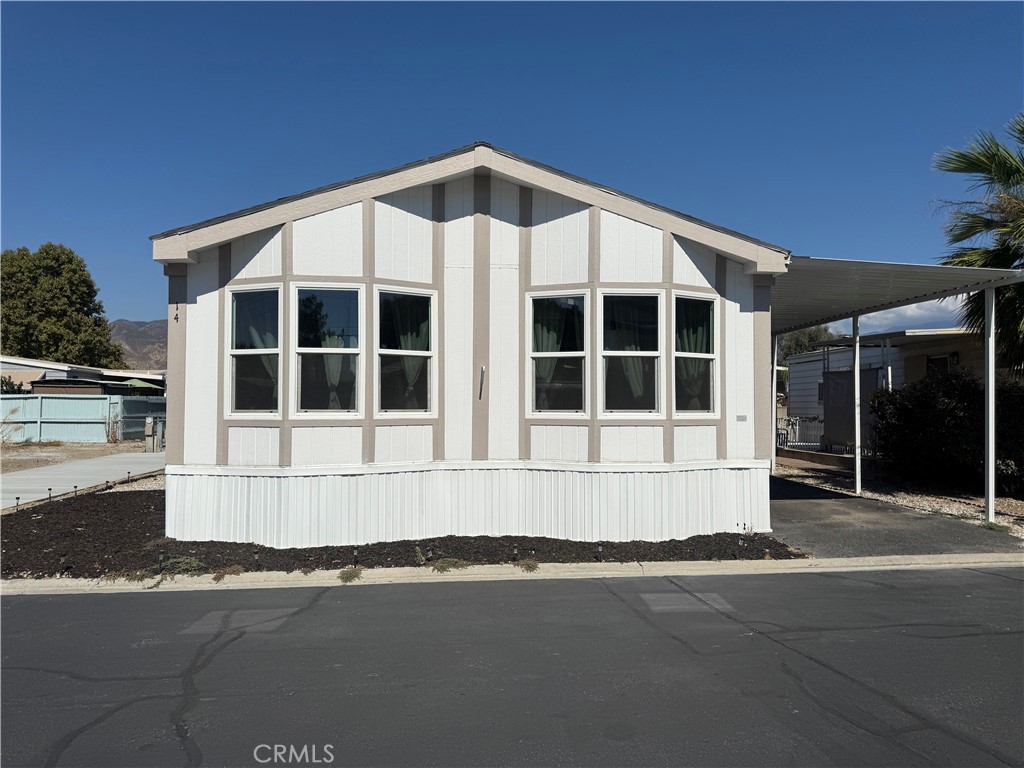 Stylish and move-in ready! This fully remodeled 2 bedroom, 2 bathroom manufactured home offers approx. 1,400 sq. ft. of bright, open living space. Step inside to find vaulted ceilings, new flooring, fresh paint, and a modern kitchen with quartz countertops, sleek cabinetry, and stainless steel appliances. The spacious primary suite includes a private bath, while the secondary bedroom and full guest bath provide plenty of room for family or guests. An indoor laundry room adds everyday convenience. Located in a well-kept community with resort-style amenities — including a pool, spa, clubhouse, and dog park — all for just $450/month land lease. Close to shopping, dining, and commuter routes, this home blends comfort, style, and value in one beautiful package. Don’t miss your chance to make it yours!