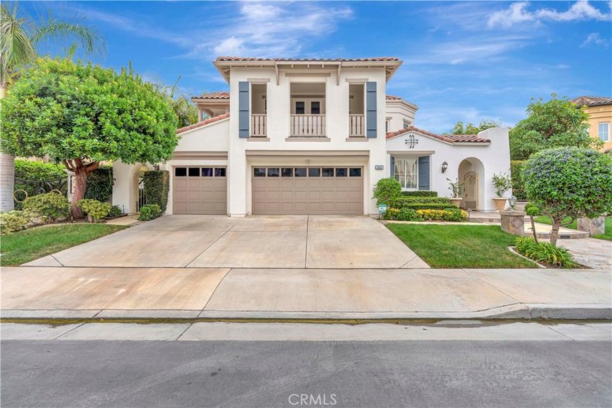 Welcome to this extraordinary residence in The Bluffs—Huntington Beach’s most prestigious and privately secured 24-hour guard-gated community. One of just 85 custom-built homes in this exclusive enclave, this stunning two-story estate offers over 4,000 square feet of luxurious living space on a nearly 9,000-square-foot lot.



Designed with elegance and modern comfort in mind, the home features 4 spacious bedrooms—all with ensuite baths—plus a private office, loft area, and even an elevator (one of the few homes in the community with this rare amenity). The primary suite is a retreat of its own, complete with a fireplace, spa-like bathroom with soaking jet tub, dual vanities, walk-in shower, expansive closet, and a private balcony. Secondary bedrooms also offer private balconies and walk-in closets, while a downstairs guest suite provides convenience and privacy.



Step into the dramatic foyer with its spiral staircase and cathedral ceilings, flowing into formal living and dining rooms, both adorned with elegant fireplaces and tall windows that frame the outdoors. The entertainer’s kitchen boasts high-end stainless steel appliances, Sub-Zero refrigerator, wine cooler, stunning Madagascar granite center island, prep area with seating, and a sunny breakfast nook that opens seamlessly to the spacious family room.



The backyard is an outdoor paradise—a Pebble-Tec saltwater pool and spa, firepit, covered pergola, lush garden retreat with an abundance of fruit trees and flowers, and multiple seating areas perfect for relaxing or entertaining year-round. The property also includes a three-car garage with additional driveway parking.



Situated just one mile from the sand and within walking distance to the wetlands, Huntington Club for golf and tennis, equestrian center, award-winning schools, and the vibrant Pacific City entertainment hub, this home combines the very best of coastal lifestyle and community living.



Don’t miss this rare opportunity to own in The Bluffs—where timeless luxury meets the heart of Huntington Beach.