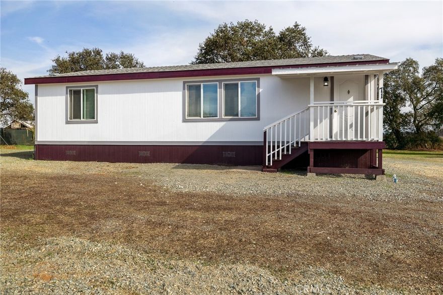 Nearly new manufactured home on a permanent foundation, built in 2020 and barely lived in. This property includes four parcels totaling 5 acres, ideally located at the end of a quiet cul-de-sac for added peace and privacy. The home offers 2 bedrooms, 2 bathrooms, a spacious living area, and a well-appointed kitchen with ample storage and all appliances included. Everything is less than five years old—turnkey and move-in ready. The property also features a work shed and a Conex storage container, providing plenty of space for tools, hobbies, or storage needs. Conveniently located just minutes from town for easy access to shopping, dining, and more.