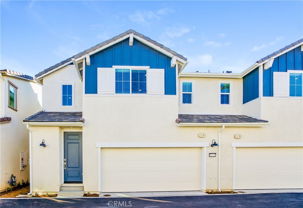 This home is professionally managed by Tricon Residential, dedicated to creating exceptional rental experiences. Featuring three bedrooms, two and one half bathrooms, and approximately 1,457 square feet, this well-maintained home offers a high standard of rental living, supported by a team that puts residents first. Tricon Menifee is a secure gated rental community nestled between San Diego and Orange County. Enjoy virtually maintenance-free living with the conveniences of smart home technology including automatic thermostat control and keyless front door entry. Every home offers open concept designs including stainless steel appliances, quartz countertops, two-car attached garages, and in-home washer and dryer. Enjoy well-maintained community amenities including a lap pool and spa, sundeck with ample seating, dog park, tot lot/playground, fire pit, BBQ area, fitness center and clubhouse.