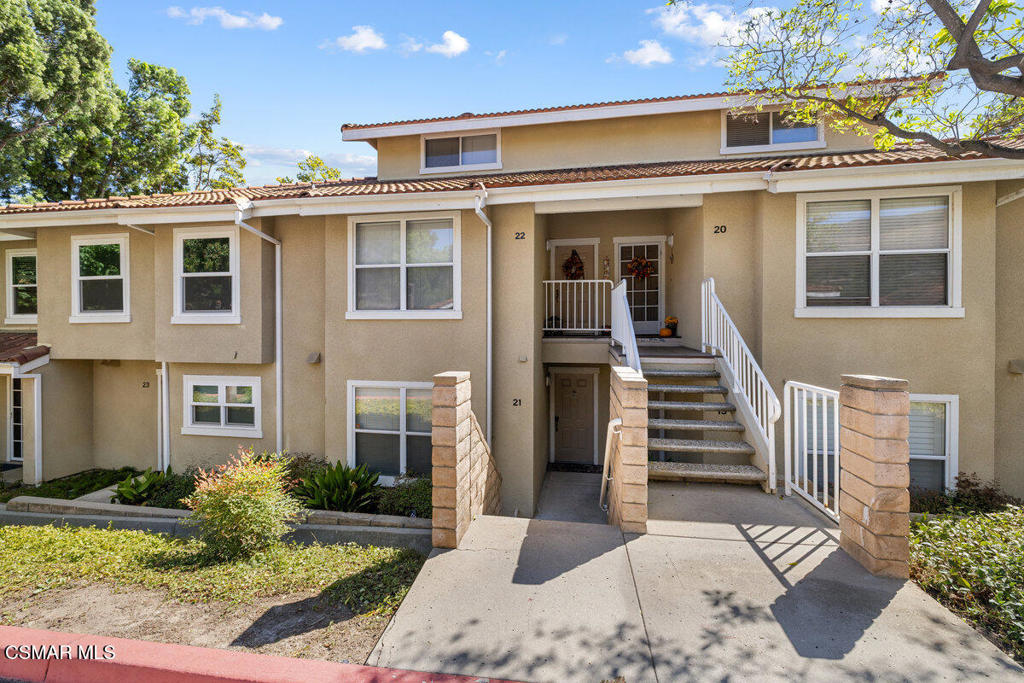 Nestled in the Simi Valley Hills, this lower unit condo has views of the Valley. Perfect for First Time Buyers, or Downsizing. Single Level Unit, Upgraded throughout, with beautiful neutral wood-like flooring, granite counters, stainless appliances, custom stone fireplace, stacked washer/dryer, upgraded bath with shower/tub and granite counter sink. The living room leads to a lovely balcony, to enjoy the view. Gated complex, separate garage has storage and easy access.