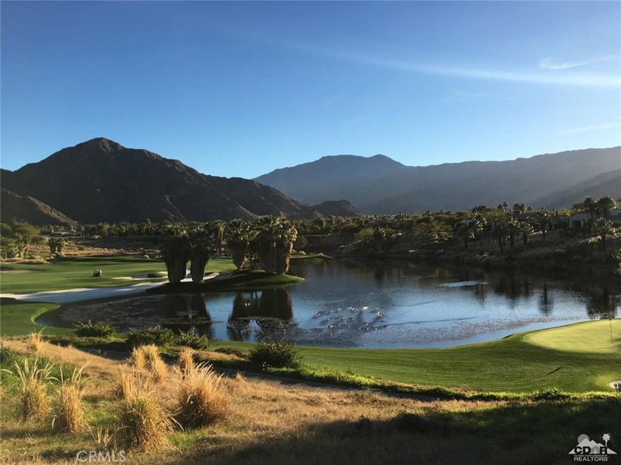 Tremendous Southern view corridor over Tradition Golf Club's largest body of water. Over a half acre in size, this premier parcel boasts a vista that is second to none...three greens, 2 fairways, all around a generous water feature and a footbridge inspired by Augusta National. Elevated above the #7 green complex, this parcel offers skybox views of this incredible playground below. Truly spectacular and arguably one of the best remaining view lots left in Tradition if not all of La Quinta!