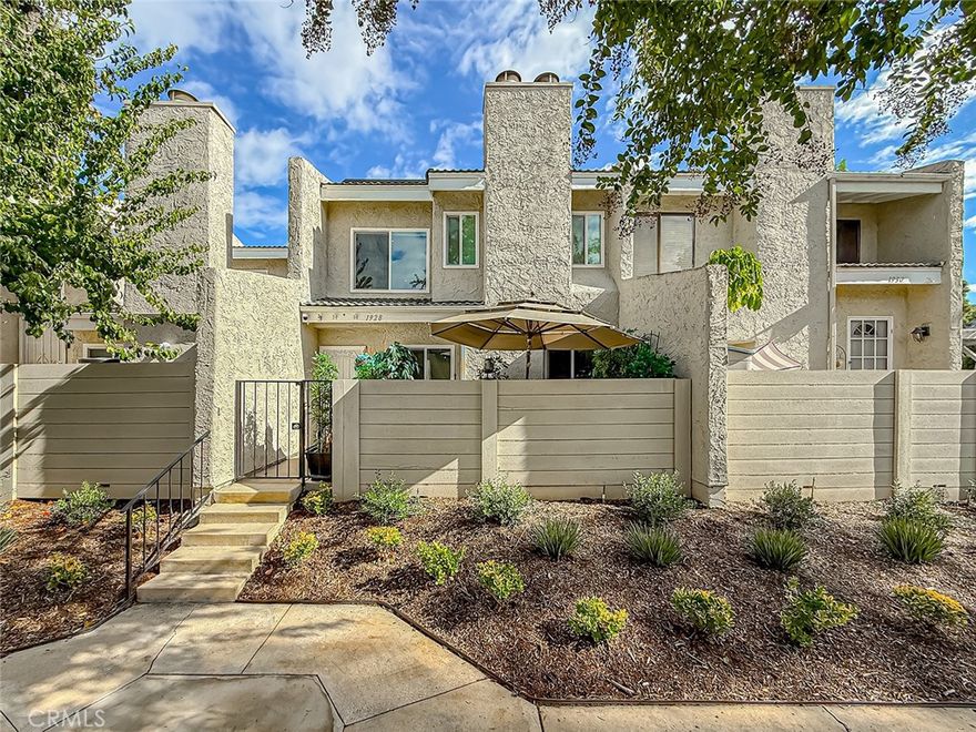 Elegant Two-Story Townhome | 1,724 Sq Ft of Comfortable, Modern Living
Stonegate Villas – One of the Most Private & Peaceful Locations in the Community
Welcome home to this beautifully updated townhome tucked into a quiet corner of East Simi Valley, surrounded by open green space and lovely mountain views. From the moment you step inside, the bright and open layout feels inviting, warm, and thoughtfully designed.
The living room features smooth ceilings with recessed smart lighting, dual-paned windows, rich tumble-travertine and wood-like tile flooring, and a charming raised-hearth brick fireplace that instantly feels like home. The space flows easily into the dining area and remodeled kitchen, where you’ll find stunning granite countertops, custom cabinetry, Samsung stainless-steel smart appliances, recessed smart lighting, and a breakfast bar perfect for casual meals or morning coffee.
A skylight brightens the staircase as you head upstairs to the spacious primary suite. This retreat offers a cozy sitting area, recessed smart lighting, a second raised-hearth fireplace, dual custom walk-in closets with motion-sensor LED lighting, and a spa-inspired bathroom featuring French vanities with smart lighting, slate shower walls, and a relaxing alcove soaking tub. An additional private room within the primary suite works wonderfully as a nursery or home office.
Two secondary bedrooms are located down the hall, each well-designed with recessed lighting and access to an updated bathroom featuring an Italian-slate walk-in shower with a built-in bench and recessed wall storage.
The home also includes a fully upgraded garage with a Tesla/EV charger, myQ smart opener with camera, Tesla solar inverter connected to 15 Tesla solar panels on the roof, and new insulation.
Step outside to your private front patio—perfect for outdoor dining or unwinding under the umbrella—while enjoying nearby open greenbelts.
The Stonegate Villas community offers wonderful amenities, including a sparkling pool, relaxing spa, and clubhouse.
Prime East Simi Location
Just minutes to parks, hiking trails, shopping, restaurants, top-rated schools, and easy access to the 118 freeway.
This home blends comfort, charm, and modern upgrades—making it a wonderful place to call home.
