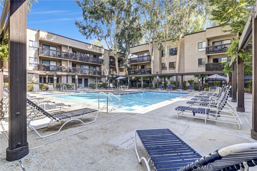 Welcome to this ideally located, upgraded ground-floor unit in a sought-after gated community—perfectly positioned just steps from the building entrance, exit, and all on-site amenities. This move-in-ready condo offers the ultimate in convenience and comfort, with seamless access to the pool, spa, gym, and recreation area, as well as 24-hour security for peace of mind. 



Inside, enjoy recent upgrades including beautiful granite countertops in both the kitchen and bathroom, and mirrored closet doors that enhance the space with added light and functionality. The spacious layout flows effortlessly to a large private patio, ideal for relaxing or entertaining.



Centrally located near Topanga Canyon Blvd and Ventura Blvd, you’re within walking distance to Woodland Hills Park, public transportation, The Westfield Mall, The Village, grocery stores, and a variety of dining—from quick bites to fine cuisine. Commuters will love the easy access to major freeways.



Additional highlights include two assigned parking spaces (#641 & #642) and ample guest parking for visitors. Whether you're a first-time buyer or looking for a prime investment, this property offers location, lifestyle, and value in one.



Don't miss this opportunity to own in one of Woodland Hills' most convenient communities.