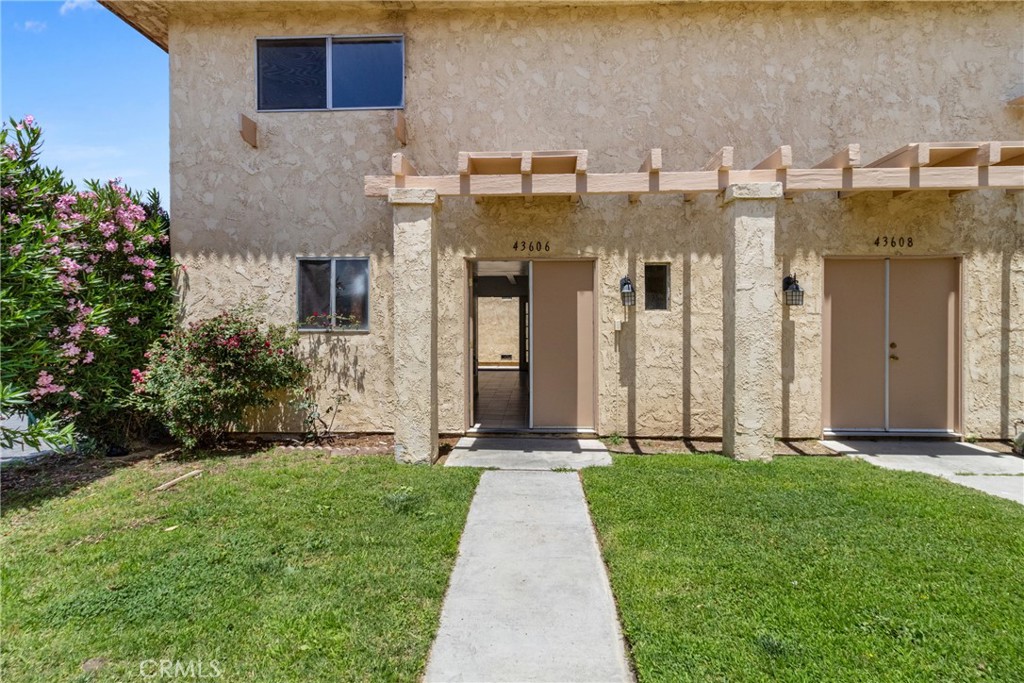 Welcome to a beautifully updated 2 bedroom, 2 bathroom, 2 story condo offering 1,008 sq ft of comfortable living space. Recently refreshed with brand-new bedroom flooring and fresh interior paint, this home is move-in ready and full of potential. The smart floor plan features spacious bedrooms, ample storage, and a cozy living area that flows seamlessly throughout. Step outside to your private patio yard, perfect for relaxing or enjoying your morning coffee, with direct access to a detached 2-car garage for added convenience. Located just off Avenue K near Sierra Highway, this condo offers easy access to shopping, dining, and major commuter routes. The community also features a pool, and the HOA includes water, trash and insurance — all at a modest monthly rate. Whether you’re a first-time buyer or investor, this is a rare opportunity to own a well-priced property in a central Lancaster location.