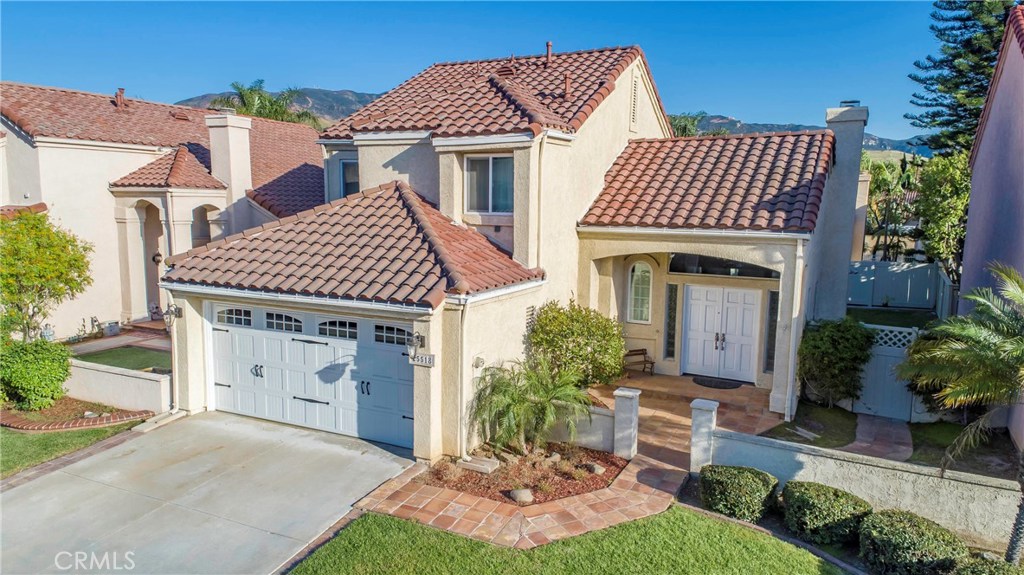 Highly upgraded home in the great community of Villa del Rio. Open entry into spacious living room with cathedral ceilings and a cozy fireplace. Completely remodeled kitchen with upgraded appliances, quartz counters & glass tile, stainless farmhouse sink, beautiful cabinets with glass cupboards, and self-closing drawers. Beautiful porcelain tile floors throughout the first floor. Upgraded guest bathroom downstairs with granite counter. Two spacious guest bedrooms upstairs and an upgraded guest bathroom with a granite counter. Large primary suite with cathedral ceilings, a ceiling fan, and walk-in closet. The primary en-suite has been completely upgraded with dual sinks in a free-standing beautiful wood cabinet, glass tile, walk-in shower with seat, and beautiful marble. The backyard is designed for entertaining with covered patio, ceiling fan, and a spacious lawn. The 2-car garage has epoxy flooring and a separate laundry area.