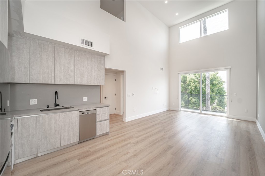 Welcome to a stunning two-story luxury apartment in Silver Lake, where sophistication and natural light converge to create a truly exceptional living space. This bright and spacious unit is designed to elevate your lifestyle, with large windows throughout and the balcony that invite an abundance of sunlight and provide picturesque views of the surrounding area. Step inside and discover a world of luxury and comfort. Each of the two bedrooms in this apartment is thoughtfully designed with a custom-made built-in wardrobe, offering ample storage space for your clothing and personal belongings. Storage space is an essential component of comfortable living, and this luxury apartment understands that. Additionally, this luxury apartment includes the convenience of its own washer and dryer. In addition to the remarkable features within the unit, this luxury residence also provides access to an exquisite rooftop deck boasting breathtaking 360-degree views of Los Angeles. With security cameras strategically placed throughout the premises, your safety and well-being are our top priorities.This luxury unit in the heart of Silver Lake represents the pinnacle of sophistication, combining stylish design, modern conveniences, and a prime location. Experience the epitome of luxury living in Silver Lake with this exceptional two-bedroom, two-bathroom apartment.