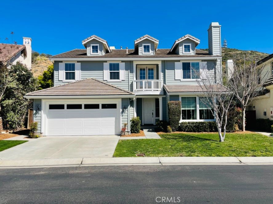 ABSOLUTELY STUNNING 5 bedroom, plus loft area and balcony, 4-1/2 bath, 3 car tandem garage, quiet cul-de-sac, approx. 3535 sq/ft home in the desirable gated community of Promontory Ridge in San Elijo Hills. The downstairs has an open floor plan with separate living and family rooms each with fireplaces, formal dining, kitchen with breakfast bar, separate kitchen dining room area with ample storage, laundry room with wash basin and storage cabinets, 1/2 bath for guests and an additional 3/4 bath with shower adjacent to the downstairs bedroom. The gourmet kitchen has ample cabinet space for storage and island. There is new interior and exterior paint, tile flooring throughout the main walkways downstairs, kitchen and all bathrooms and newer carpet throughout the remainder of the home. The upstairs has 4 bedrooms including the huge primary suite with retreat and a giant walk in closet. One of the other bedrooms has it's own full bath and the other 2 bedrooms share a Jack & Jill bath. The loft area has lots of storage and a double door balcony overlooking the front yard and neighborhood. This home is walking distance to San Elijo Elementary and Middle Schools and parks (paved path with no vehicles), local shops, restaurants and grocery store. The community has walking trails and so much more! The front and back yards are fully landscaped and the back yard has a large patio area that is shaded from the home and there are no homes directly behind for privacy! The back yard has views of the natural hillside landscape...ready for your patio set and BBQ! This home is Gorgeous!