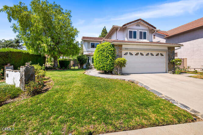Step into comfort, style, and everyday luxury at 19721 Turtle Springs Way, a beautifully upgraded two-story home nestled on a premium corner lot within the highly sought-after, guard-gated community of Porter Ranch Estates. Boasting 3 generously sized bedrooms and 2.5 baths, this turnkey property offers the perfect blend of modern upgrades and timeless charm. As you enter, you'll appreciate the thoughtful features throughout, vinyl flooring in the main living areas, smooth ceilings, crown molding, recessed LED lighting, and a cozy fireplace that creates a warm and inviting atmosphere. The standout kitchen is both functional and elegant, featuring stainless steel appliances, upgraded cabinetry with convenient pull-out drawers, and plenty of storage, including an additional upstairs storage space. Upstairs, the hall bath includes an oversized jetted tub for relaxation, while the spacious primary suite offers a peaceful retreat with a large walk-in closet and a dual-sink vanity for that spa-like experience. Light-filled bedrooms provide the ideal setting for rest, work, or play. Outside, enjoy beautifully maintained landscaping and a peaceful backyard sanctuary, ideal for morning coffee or evening gatherings. As a resident of Porter Ranch Estates, you'll enjoy exclusive access to resort-style amenities, including sparkling pools, a spa, tennis, volleyball and basketball courts, dog park, a playground, and 24-hour guard-gated security. Conveniently located near The Vineyards at Porter Ranch, hiking trails, parks, and major freeways, this home truly offers the best of comfort, community, and convenience. Don't miss your chance to call this beautiful home yours!