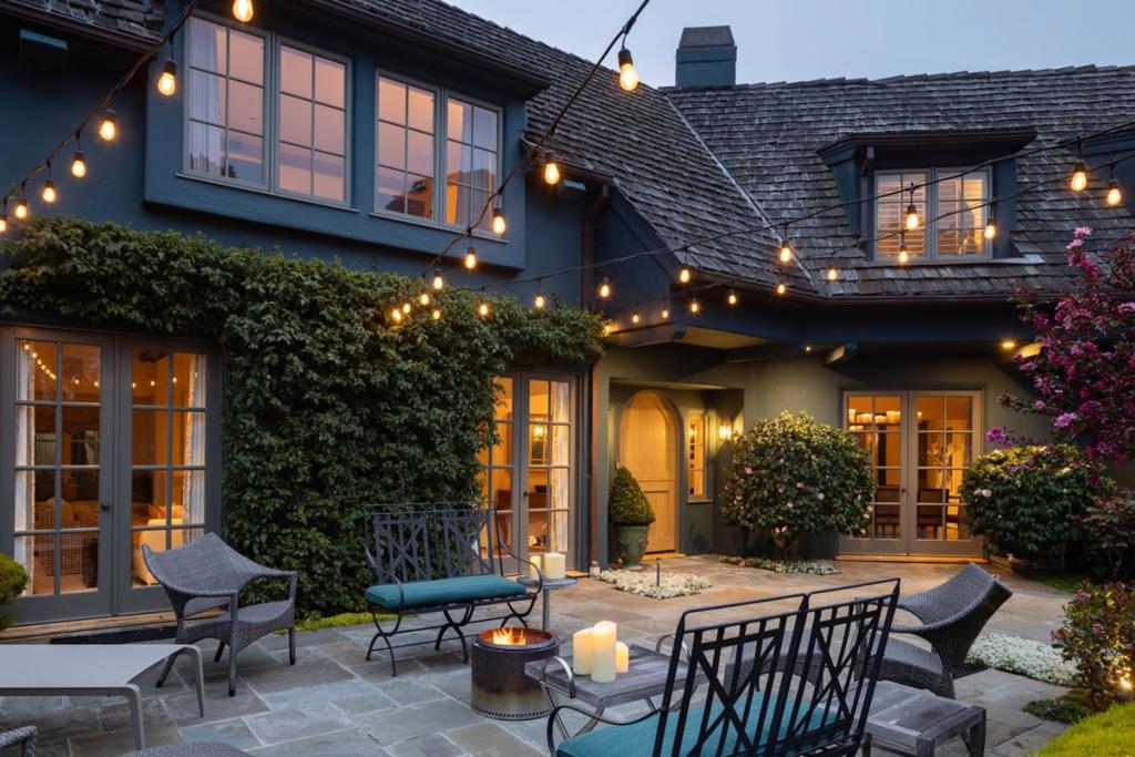 Located on a corner lot in a prime Carmel Point location just moments from Carmel Beach, this exceptional home offers breathtaking ocean views, beautifully designed living spaces, and seamlessly blends elegance, warmth and comfort. Key features include an inviting formal entry with charming Dutch door, spacious living room with wood-burning fireplace, open beam ceilings, floor-to-ceiling windows, elegant formal dining room, chef's kitchen with top-tier appliances and a sun-drenched breakfast room boasting high ceilings and walls of glass. The upstairs family/media room makes gathering with friends and family a must with cozy fireplace, bar sink and views of the ocean and distant Pebble Beach golf links, while the luxurious primary bedroom suite has a private, south-facing deck, and spa-like bath complete with concrete counters, teak accents, large stall shower and relaxing soaking tub with jets. The attached oversized 2-car garage provides ample storage space, and paver driveway features additional off-street parking. The fully fenced yard has multiple patio areas, tranquil water feature, lush, established greenery, rose garden, lavender patch and rock garden. This Carmel home on the point is a rare find, offering the perfect blend of luxury, comfort, privacy and location.