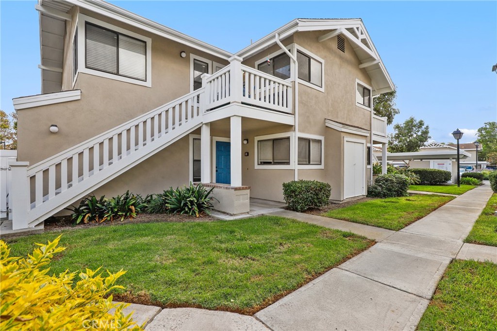 Tucked into a quiet, private corner of the community, this beautifully upgraded 2-bedroom, 2-bathroom upper end unit offers comfort, style, and convenience in equal measure. From the moment you step inside, you’re welcomed into a light-filled living space that radiates warmth and ease. Gleaming laminate flooring flows throughout the hallway, living room, and dining area, creating a seamless and modern aesthetic. The open-concept layout leads you into a charming dining space and a thoughtfully updated kitchen featuring elegant Quartz countertops, stainless steel appliances, and sleek cabinetry — perfect for preparing everything from your morning coffee to evening dinners with friends. Both bedrooms are adorned with matching laminate flooring, offering a clean and cohesive feel. The guest bedroom sits just off the hall near a full bathroom, while the spacious primary suite — tucked privately at the end of the corridor — includes its own en-suite bath with a walk-in shower and direct access to a serene private balcony. Additional features include a cozy patio at the entry, in-unit washer and dryer, included refrigerator, air conditioning, and a private storage closet downstairs. Two covered carport spaces are also included for your convenience. Enjoy the best of both worlds — a peaceful residential vibe just a short walk to Irvine Valley College, Walnut Creek Golf Course, parks, and more. This pet-friendly home is the ideal retreat for those seeking low-maintenance luxury in a prime Irvine location.