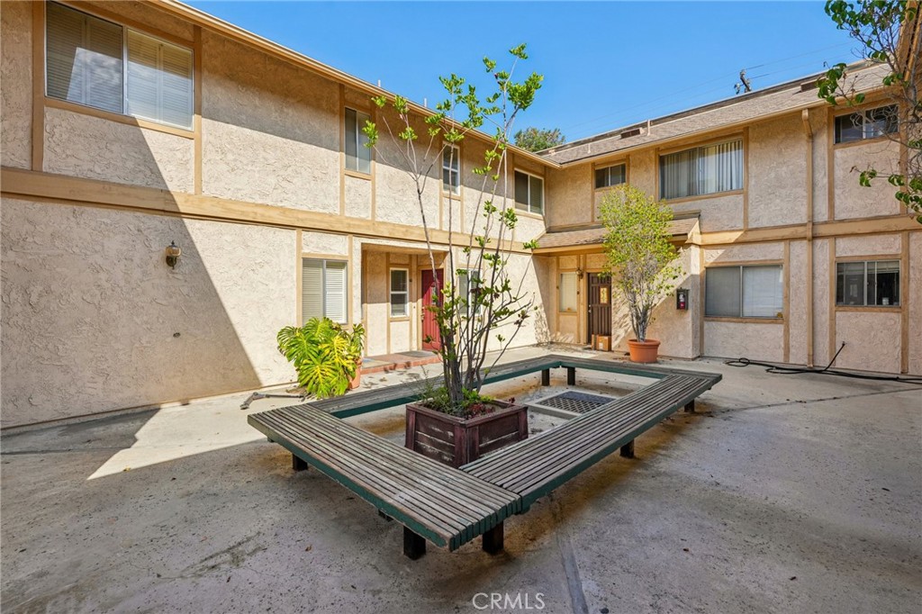 A Must See, Immaculate condition. This quiet and peaceful end unit locates in a tree-lined street, a highly desirable neighborhood. Great location. Walking distance to Santa Anita mall, supermarket, restaurants, race track, golf course and public transportation. Double pane windows, sliding doors and wood blinds. Spacious living room with a marble fireplace. Updated kitchen offers granite counter tops, good quality appliances including built-in microwave, stainless steel double door refrigerator, wood cabinetry, double wall oven. Bright and airy. The dining room sliding door leads to a big private backyard which is great for children to play and the family to relax. Rarely find this size of backyard for townhouses. Ample storage spaces for this unit. A big separate storage room next to the garage. All 3 bedrooms are upstairs. the over-sized master bedroom has a walk-in closet and a newly built balcony. All bathrooms with custom marble top vanities. Direct access to the two-car open garage. The gated community offers sparking pool and courtyards. Washer and dryer are inside the unit.