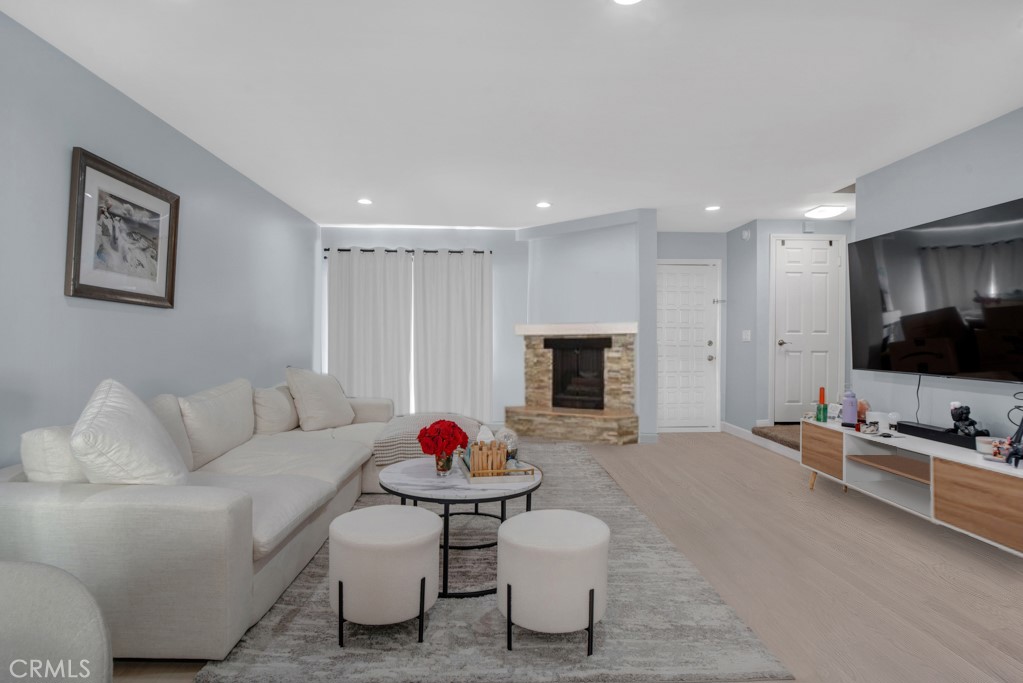 This beautifully updated townhome in a boutique 5-unit complex offers the perfect blend of style, comfort, and convenience with a thoughtful layout. The first floor welcomes you with an open-concept living and dining area featuring elegant laminate flooring, recessed lighting and fireplace. Sliding glass doors open to a private patio—perfect for indoor-outdoor entertaining. The remodeled kitchen is a chef’s dream with shaker-style soft-close cabinets and drawers, quartz countertops, a double sink with modern faucet, and stainless steel appliances including a gas stove, built-in microwave, and dishwasher. A stylish half bath completes the main level, ideal for guests. Upstairs, the spacious primary suite boasts vaulted ceilings, two large double closets, an inviting alcove perfect for a home office or reading nook, and access to the balcony. The full bathroom offers a separate tub and shower, granite-topped vanity, generous cabinetry, and an additional double closet. A full-size stackable washer and dryer and a linen closet are conveniently located just outside the primary suite. Additional features include two assigned tandem gated parking spaces, two storage cabinets, and access to a community patio with BBQ area. HOA dues cover earthquake insurance, water, sewer, and building hot water. Ideally located near the Van Nuys/Sherman Oaks Recreation Center with tennis courts, athletic fields, and a pool. Just minutes from Trader Joe’s, Westfield Fashion Square, and the vibrant restaurants and nightlife of Ventura Blvd—with easy access to the 101 and 405 freeways.This turnkey townhome has it all—style, space, and a location that can’t be beat! ALSO OFFERED FOR SALE!