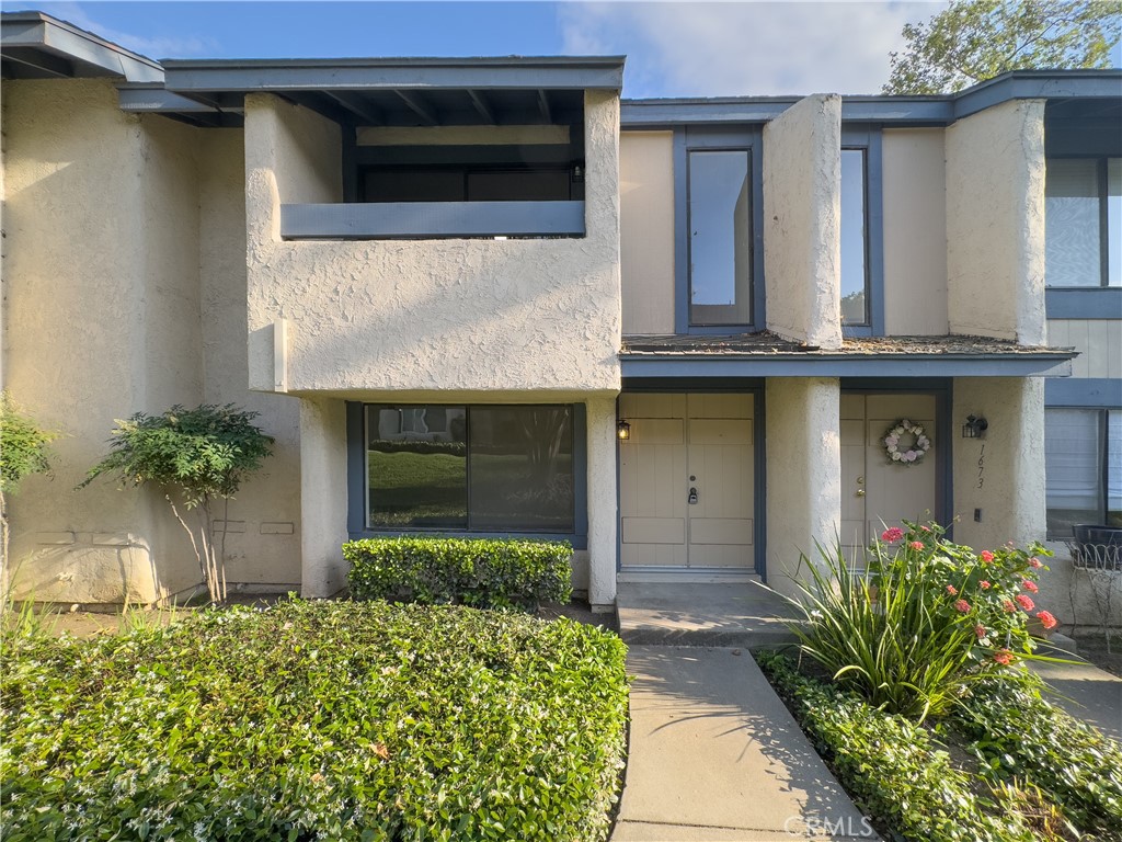 Welcome to Corsican Villas in Brea. Step into a world of endless possibilities in this exquisite Brea residence. This gem boasts three bedrooms and three bathrooms, offering the perfect canvas for your ideal living space. Prepare to be captivated by the abundance of natural light that floods through large windows, creating an airy and inviting atmosphere throughout. The living areas showcase stunning hardwood style floors, adding warmth and sophistication to every step. The sleek, modern kitchen is a culinary enthusiast's dream, featuring NEW elegant dark cabinetry, NEW gleaming Santa Cecilia granite countertops, and NEW high-end stainless steel appliances. Retreat to the luxurious primary bedroom, a spacious haven that promises restful nights and serene mornings. This home is not just a place to live; it's a lifestyle upgrade. Imagine entertaining guests in the open-concept living areas, or enjoying quiet moments gazing out at the lush greenery visible from your windows. With its prime location at 1663 Gatewood Ct in Brea, you'll have easy access to local amenities while enjoying the tranquility of your personal oasis. Don't miss this opportunity to transform your living experience and make your dream home a reality. Welcome to a space where comfort meets elegance, and every day feels like a fresh start.