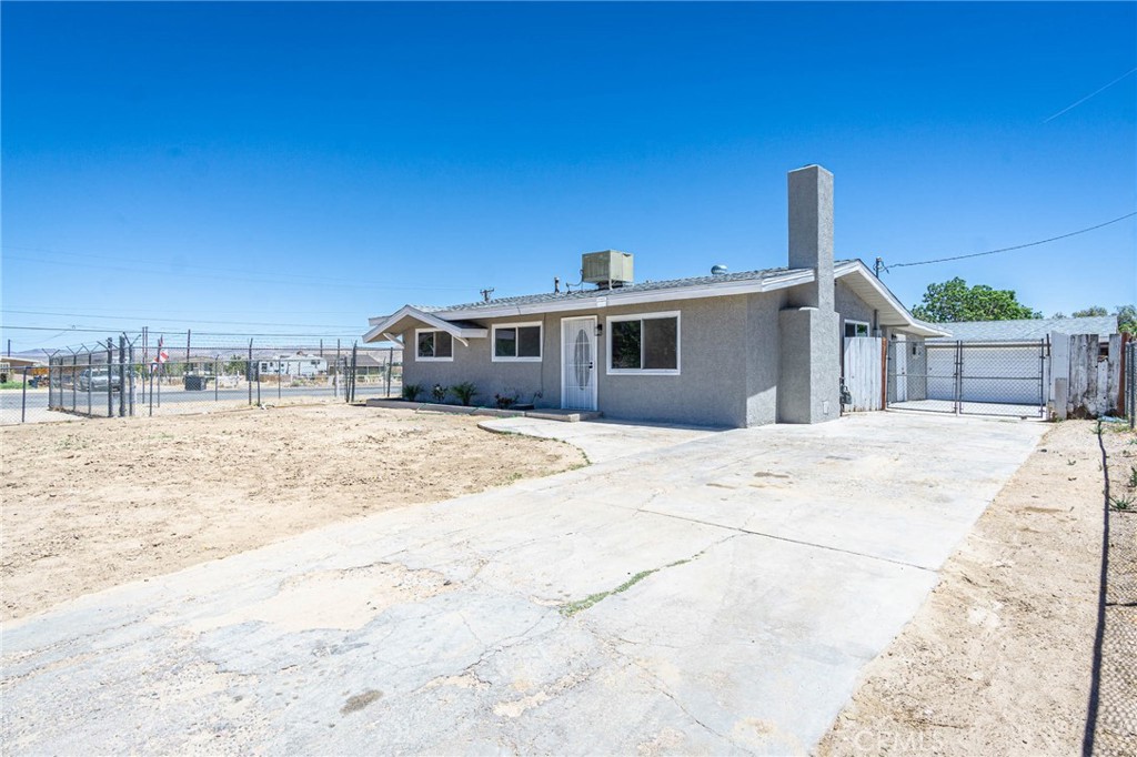 Welcome to the home you've been searching for! Located in the desirable Grandview area of Barstow, this charming property offers the perfect balance of peaceful living and convenience—just minutes from parks, restaurants, and the world-renowned Outlets at Barstow.
The entire lot is fully fenced, giving your pets room to roam safely. Recent upgrades include a brand new septic system, a new roof, and new double-pane back windows. Freshly painted inside and out, the home also features an oversized two-car garage with storage space, an insulated garage door, and a convenient side entry door.
Step inside to a well-designed floor plan centered around a dedicated dining room. The spacious living room showcases a stunning gas-lit stone fireplace—perfect for cozy winter nights. The kitchen has been beautifully updated with brand new countertops, matching backsplash, and sleek, state-of-the-art appliances. The color palette is both practical and stylish.
Each bedroom features soft carpeting underfoot, ceiling fan lights, and thoughtful details that make the space feel warm and inviting. Durable laminate flooring flows through the common areas for easy maintenance.
This is one of the best values in Barstow—don't miss your chance to make it yours. Schedule your private showing today!