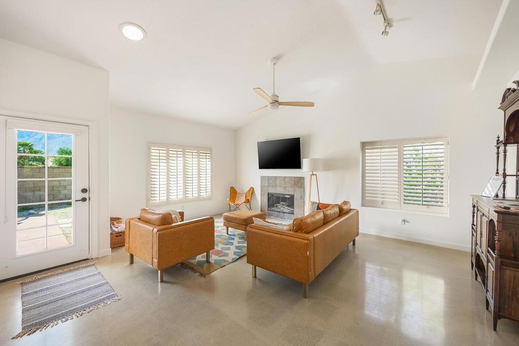 Live the Palm Springs Lifestyle - Without Compromise and assume a $452,033.63 VA 2.5% loan -This chic and updated 4-bed, 2-bath home has everything you've been looking for--a quiet location that's still walkable to shopping and everyday essentials, plus gorgeous mountain views and no HOA fees.Inside, you'll find a modern, open floor plan with soaring vaulted ceilings, fresh custom paint, and new polished concrete floors. Love to entertain? The stylish kitchen flows into your living and dining areas, all bathed in natural light.Step outside and enjoy a private front yard for sunsets, or relax in the eastern-facing backyard with a sparkling pool and new pool heater--perfect for mornings in the sun or shaded afternoons.With thoughtful upgrades throughout--smart thermostat, new irrigation, mirrors, fixtures, and more--this home is move-in ready and fully furnished (with select exclusions).Bonus: Fee simple land = you own the land. No HOA = more freedom.This home is equal parts comfort, style, and convenience. Don't miss your chance to own a slice of Palm Springs paradise!