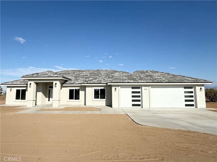 Beautiful New Home in Baldy mesa area large corner lot is in excellent location on just under 5 acres. This home is on a well-designed 2176 sqft. open floor plan with 4 bed, 4 baths, Large 3 car garage 844 sqft. formal dining room, living room and kitchen with island, stainless steel appliances, beautiful New Venantino Quartz countertops on shaker cabinets throughout the home. This home features vaulted ceilings, indoor laundry with storage, master suite has large walk-in shower, double vanities with sinks & a walk in closet. The fourth bedroom has its own bathroom, and walk-in closet could be considered as a second master bedroom. Beautiful wood looking tile floors throughout home. This home has a large stucco patio, tankless water heater, fire sprinklers, underground utilities, led lighting throughout, includes PAID OFF SOLAR**. Built to the highest of energy efficiency and quality. This home sits on a large corner lot that is partially fenced due to its size. This property has potential to be SUBDIVIDED into two separate parcels please check with county and do your due diligence.  Also located in the SNOWLINE SCHOOL DISTRICT & not far from freeway. Too many extras to list must see!