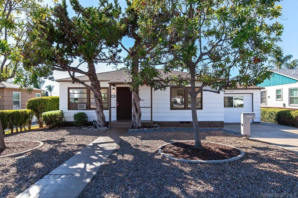 Welcome to this delightful La Mesa property featuring a 3-bedroom, 1-bath main home plus a versatile bonus studio—perfect for guests, a home office, or rental income potential. Situated on a generous 7,600 sq. ft. flat lot, this property offers plenty of space and opportunity. Step inside to find beautifully refinished original hardwood floors that bring warmth and character, complemented by brand new carpet in one of the bedrooms and new tile in the bathroom. The bright eat-in kitchen is ideal for casual dining, and the attached 10 × 9 ft laundry room adds everyday convenience. A brand-new roof provides peace of mind for years to come. The detached studio features its own separate entrance, a kitchenette, and a private bathroom, offering flexible living arrangements for extended family, guests, rental possibilities or a dedicated home office. Imagine the endless possibilities on this expansive, flat lot, already enhanced with thoughtful landscaping and a generous storage shed. Both the main home and studio unit have fresh interior paint making them move in ready. Centrally located near parks, shopping, and freeways, this charming property combines comfort, character, and potential—all on a spacious lot in a desirable La Mesa neighborhood.