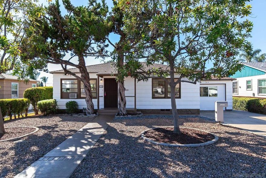 Welcome to this delightful La Mesa property featuring a 3-bedroom, 1-bath main home plus a versatile bonus studio—perfect for guests, a home office, or rental income potential. Situated on a generous 7,600 sq. ft. flat lot, this property offers plenty of space and opportunity. Step inside to find beautifully refinished original hardwood floors that bring warmth and character, complemented by brand new carpet in one of the bedrooms and new tile in the bathroom.  The bright eat-in kitchen is ideal for casual dining, and the attached 10 × 9 ft laundry room adds everyday convenience. A brand-new roof provides peace of mind for years to come. The detached studio features its own separate entrance, a kitchenette, and a private bathroom, offering flexible living arrangements for extended family, guests, rental possibilities or a dedicated home office.   Imagine the endless possibilities on this expansive, flat lot, already enhanced with thoughtful landscaping and a generous storage shed.  Both the main home and studio unit have fresh interior paint making them move in ready.  Centrally located near parks, shopping, and freeways, this charming property combines comfort, character, and potential—all on a spacious lot in a desirable La Mesa neighborhood.