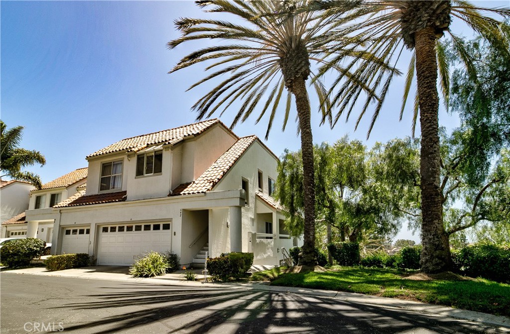 Welcome to Encantamar – a beautiful gated coastal community offering resort style living just minutes from the beach.
This upgraded single story home enjoys a prime location within the community, offering enhanced privacy as an end unit with no neighboring residence on one side. With two spacious bedrooms with newly installed carpet and two updated bathrooms, this home features an open concept layout, vaulted ceilings that enhance the sense of space, a walk-in closet, a large upgraded main shower, and a newly painted interior.
The living and dining areas share a double sided fireplace, perfect for relaxing evenings. The kitchen includes brand new stainless-steel appliances and porcelain tile flooring, which also runs throughout most of the home, providing a sleek and modern feel. You’ll also enjoy central heating and air conditioning, ensuring year-round comfort.
Step outside to enjoy two private decks, ideal for morning coffee or entertaining guests. A detached two-car garage provides secure parking and storage.
The community features beautifully maintained grounds and a peaceful atmosphere just minutes from the beach and Dana Point Harbor. Enjoy access to a sparkling community pool and rejuvenating spa—perfect for relaxing after a long day. The facilities offer both indoor bathrooms and a convenient outdoor shower—perfect for rinsing off after a day in the pool. Enjoy cozy evenings by the outdoor fireplace, and take advantage of the nearby clubhouse for social gatherings, events, or recreation. Maintain your active lifestyle in the state-of-the-art fitness center, just steps from your front door. Conveniently situated across the street from the cherished Ocean Ranch Village center, there are multiple options for shopping and dining within walking distance, as well as a movie theater.
This lovely home combines privacy, location, and lifestyle—don’t miss your chance to make it yours!
