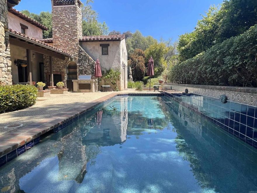 Tranquil and nestled in the exclusive golf course community of The Bridges at Rancho Santa Fe, this single level Italian Villa features 3 bed and 3.5 baths tucked away in a private cul-de-sac surrounded by lush landscaping and stunning mountainous views. The main home is tastefully renovated with two (2) spacious bedroom suites and two (2) additional rooms which could be used for office, library, flex space or another bedroom. A detached casita third (3rd) bedroom suite is perfect for guests and extended family.  Unwind in the large main suite with high ceilings and an open renovated kitchen with breakfast bar! The covered loggia with fireplace overlooks a relaxing backyard with your own private pool and jacuzzi. Entertain your friends and family with the built in BBQ and generous side yard perfect for relaxing and entertaining!  The home has a two (2) car garage and ample storage. This home is the perfect blend of luxury and comfort!