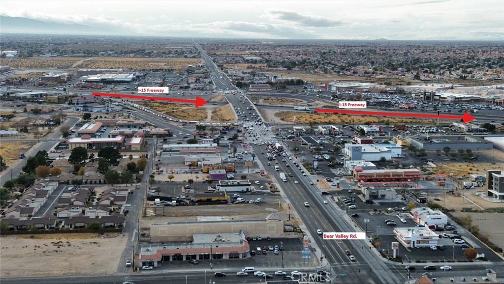Awesome Building Site - Stop Renting and Build Your Own Building...! This property "Zoned C2" allows for a variety of Commercial uses including: Retail, Entertainment, Professional offices, Financial establishments, Restaurants, Hotel and Motel lodging; with many additional Investment Opportunities. If, Super High Traffic Counts are what you are looking for then you found your property; according to Cal-Trans 2023 Study 50,000+ vehicles a day travel Bear Valley Road bordering the cities of Victorville and Hesperia - This Bear Valley Road location is two traffic lights east from the I-15 and Bear Valley Inter-change; add in flexible terms and the combination is unbeatable - Best Opportunity on the Market. Ingress and Egress issues disappear with a considerable "106 Feet of Frontage" add 30,740 square feet (.7056 acre) to work with on your development plan, and your Business and Golden Opportunity is one step close to reality. The land is 100% usable, flat, usable land, and ready for development. Whether you're looking to build a stand-alone business, a multi-tenant complex, or a mixed-use development, this lot offers maximum exposure, perfect for businesses seeking visibility and easy access to our High-Desert Major Regional Markets. The Bear Valley location is home to many of the Fortune 500 Companies and are Anchor Draws for your Business such as Home Depot, Amazon, McDonalds, Exxon Mobil, Dick's, Carl's Jr., Baker’s Restaurant, Dunkin Donuts, and "The Mall of Victor Valley to name a few. The surrounding area is experiencing significant growth, making this lot an excellent choice for businesses looking to capitalize on our High Desert Booming Market.