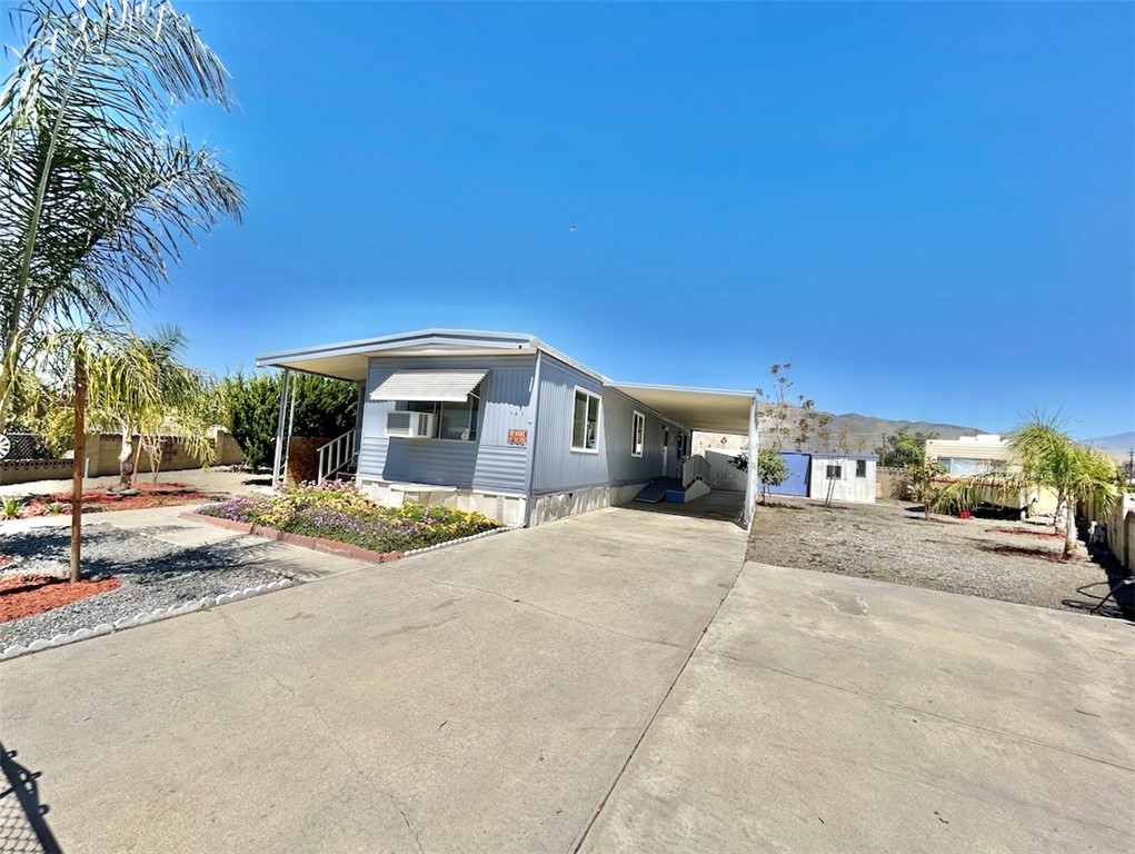 Own the Land — No Space Rent!
Welcome to one of the largest lots in the Cottonwood Estates 55+ senior community! Enjoy the freedom of true homeownership with no space rent and an unbelievably low HOA of just $50 per year.
Located on a peaceful cul-de-sac in North San Jacinto, this 1-bedroom, 1-bath home is filled with natural light and sits on a spacious 6,969 sq ft lot. Parking is a breeze with ample space for multiple vehicles, plus on-site RV hookups for your motorhome.
Step into the sunroom, which adds approximately 175 sq ft of additional covered living space, perfect for relaxing or entertaining.
Additional features include a separate laundry room, fruit trees, and three storage sheds—ideal for extra storage and staying organized.
This is a rare opportunity to own land in a quiet, established senior community. Don’t miss your chance to call it home!