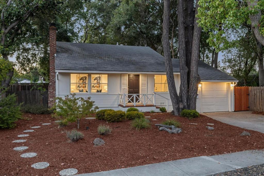 In the sought-after Flood Park neighborhood of Menlo Park, this charming 3-bedroom, 1-bath home offers 1,200 sq. ft. of thoughtfully designed living space on an oversized 9,339 sq. ft. lot - a rare opportunity to expand, enjoy an expansive backyard, or create your dream home. Hardwood floors, abundant natural light, newer windows in all bedrooms, central A/C, and a flowing floor plan that balances comfort and functionality. The light and bright living/dining combo is accented by a fireplace and picture windows overlooking the front gardens. The updated kitchen features a large center island with bar seating, modern finishes and stainless steel appliances. The remodeled bath offers convenience, while the attached 1-car garage provides easy access. Outside, the expansive backyard features generous patios and endless possibilities for entertaining or unwinding. Close to top-rated Menlo Park schools, local parks, and Highway 101. This home is a true gem in the desirable Flood Park neighborhood, ready for you to move in and enjoy!