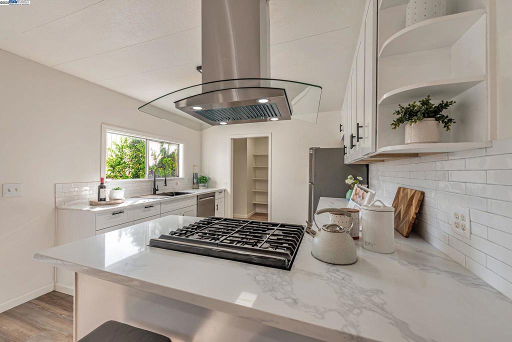 Sunnyvale Gem: Modern Living at Willow Ranch Welcome to Willow Ranch, a premier 55+ community in the heart of Sunnyvale. This stunning, fully renovated home offers modern luxury and convenience, feeling more like a chic single-family residence.  Step inside the generous, open-concept floor plan, where every detail has been thoughtfully updated. The pristine modern aesthetic features sophisticated black light fixtures and hardware. The home is completely turn-key with new paint (in/out), new high-quality LVP flooring, and new carpet on exterior porches.  A versatile enclosed porch off the living room offers highly desirable extra living space—perfect for a sunroom, office, or quiet retreat.  The gourmet kitchen boasts all-new cabinetry, white quartz countertops, and a peninsula island. Stainless steel appliances are included, a large walk-in pantry. Great display and storage space is provided by a built-in glass-fronted cabinet in the dining area.  The spacious primary suite features a walk-in closet and a spa-like ensuite bath with dual sinks and gorgeous vanity.   Located conveniently near shopping, restaurants, freeways 101 & 237. The established community provides an active, social lifestyle with amenities: clubhouse, pool, and spa. Don't miss this stylish, fully updated home! Fireplaces: NO