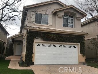 Located on a cul-de-sac, within the gated Verdigris community,this lovely 2-story home features 3 bedrooms & 2.5 baths,open floor plan, living room with vaulted ceilings & dining area with recessed lighting. Kitchen has light cabinetry with lots of cabinet space, white tiled counter tops, white appliances & overlooks a warm & cozy fireplace with custom built-ins. All bedrooms are located upstairs including the separate laundry room. Master bedroom features high ceilings, master bath has separate shower & tub plus a walk-in closet! Dual paned windows throughout,2in wood mini blinds, closet organizers & a security system! Backyard has patio with beautiful colorful plants & a large grassy area with automatic sprinklers in front & back,two car attached direct access garage with roll up garage door.
