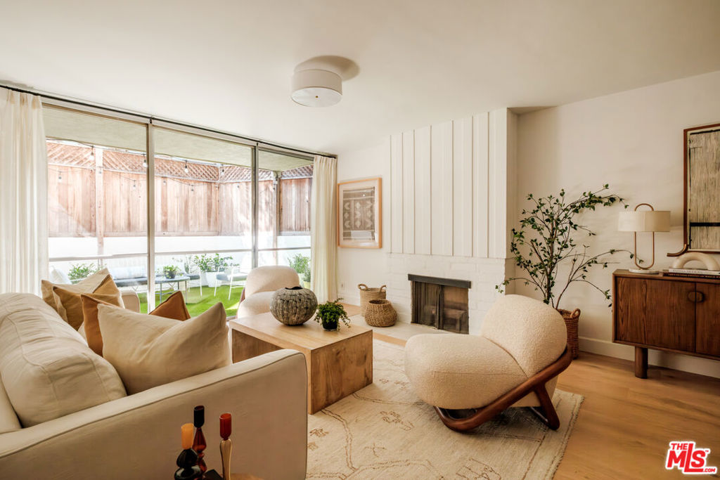 Life here is pure California cool: a completely reimagined condo with seamless indoor-outdoor flow and a private patio made for living. The expansive outdoor space, recently updated with new turf, serene landscaping, and a new stucco privacy wall, is a rare find in condo living and creates the perfect setting for morning coffee, weekend gatherings, or open-air dinner parties that stretch into the evening. Inside, the vibe is just as inviting. Wide-plank floors, freshly painted interiors, and designer lighting set a modern, airy tone, while the fully remodeled bathrooms bring a spa-like touch to everyday routines. The updated kitchen isn't just for cooking, it's designed for connection. With clean finishes and an easy flow into the dining and living areas, it's the kind of space that makes weeknight dinners, weekend brunches, and impromptu hangouts feel effortless. Heather Village offers one of the most resort-like lifestyles in Culver City. Residents enjoy three sparkling swimming pools, two spas, a fitness center, tennis courts, a clubhouse, playground, picnic and barbecue areas, lush landscaped grounds, and walking paths that create a true sense of community. Controlled access, guest parking, and a pet-friendly environment add to the convenience. Located in the Fox Hills neighborhood, you're minutes from everything coffee at Super Domestic, shopping at Platform, music at The Culver Steps, and design and dining at the Helms Bakery District. With Playa Vista, Silicon Beach, and LAX close by, this home combines modern style, resort amenities, and unbeatable convenience. Turnkey, stylish, and rare this Culver City condo blends California cool with everyday comfort.