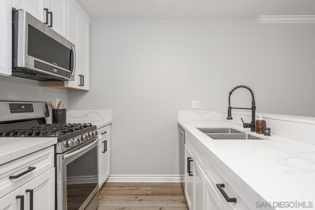 EXCEPTIONAL rental in Mission Valley! Offered Furnished or Unfurnished, Highly upgraded, newly remodeled, this place has everything! Beautiful white cabinets, Calcutta quartz counter-tops, wood floors, stainless steel appliances, open floor plan, end unit, quiet, safe & lots of privacy. Community Amenities: Pool, hot tube, basketball court tennis courts, and dog park. Centrally located, Everything is close by, a short ride away. Close to USD, Old Town, Malls, restaurants, bars, shopping, breweries, and entertainment. Easy freeway access. Ideal for traveling Doctor or Nurse, cooperate relocation or Military PCS into the area.