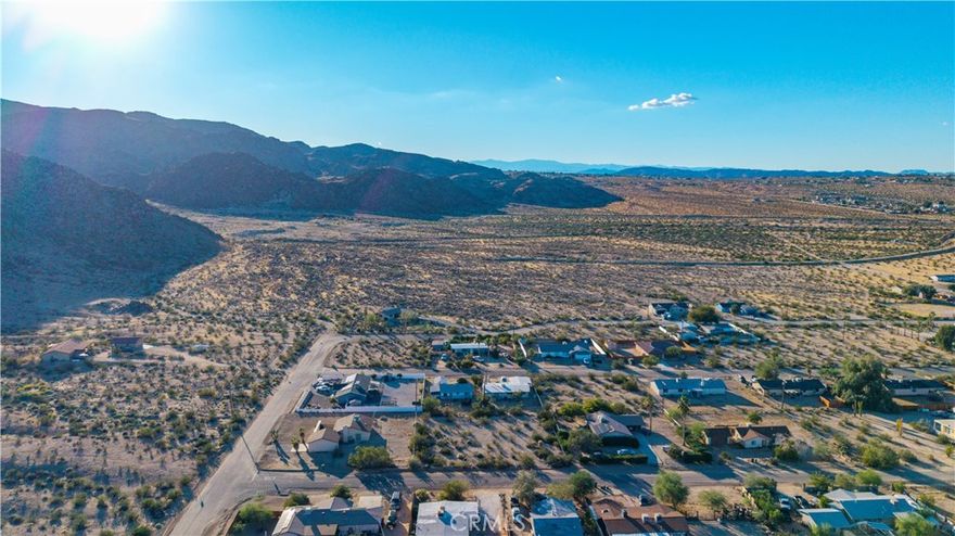 Spacious 15,000 square foot parcel located in the desirable Smoketree neighborhood, offering a great opportunity to build your desert home or investment property. The lot sits in a peaceful residential area surrounded by natural beauty and scenic mountain views. Utilities are believed to be available at the street—buyer to verify.

Just minutes from Joshua Tree National Park, the 29 Palms Art Gallery, and Tortoise Rock Casino, this location provides easy access to local dining, shopping, and community favorites like the weekly Farmers Market and Joshua Tree Music Festival. Experience the beauty and tranquility of the Hi-Desert lifestyle in this wonderful setting.