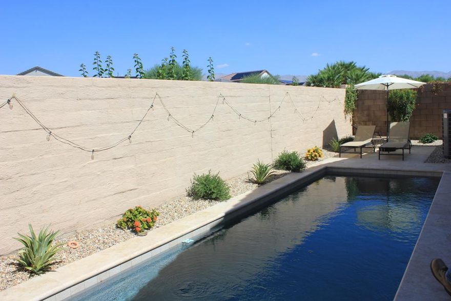 New Listing... Terra Lago 4 Bedroom, 3 Bath Pool Home. Living Area with cozy fireplace. Kitchen with Breakfast counter bar, stainless steel appliances, Pantry. Primary Bedroom with King Sized Bed, Primary bath with separate tub/shower. Dual Sink Vanity. Large Walk in Closet. Guest bedrooms with Queen Beds, bath adjacent. 4th bedroom with ensuite bathroom. Covered Patio, Pool for rest & relaxation. Easy access to Clubhouse with 24 hour access to Fitness Center, Game Room, Heated Community Pool and Spa, Kids wading pool. Playground area, parks, miles of walking within community. Great Location, Enjoy Hiking, Entertainment, Casinos, Acrissure Arena, Shopping, Dining.  Golf Club at Terra Lago adjacent to community.