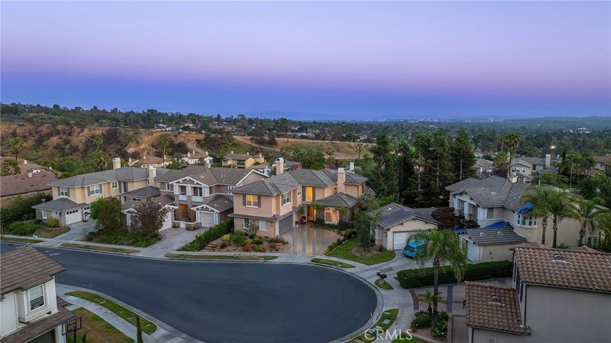 View! View! View! Welcome to this stunning Mediterranean-style home tucked inside Altadena’s exclusive guard-gated La Vina community. This spacious two-story residence offers 5 bedrooms and 4.5 bathrooms across approximately 3,348 square feet of elegant living space, designed for both comfortable family living and upscale entertaining. The grand entryway greets you with soaring ceilings and a sweeping staircase, leading into refined formal living and dining rooms. The open-concept kitchen flows effortlessly into a warm family room with a fireplace, and features a center island, a wine cellar, and direct access to a serene patio with panoramic canyon, city, and mountain views. Ideal for multi-generational living, the home includes a first-floor En-suite bedroom, while upstairs boasts four additional bedrooms—including a luxurious primary suite, spa-like bathroom, walk-in closet, and a private balcony with stunning vistas. Additional highlights include hardwood flooring, new interior paint, new water heater, new landscaping, HVAC (2016), high-end bidet toilets, whole-house water filtration system (2019), security system, laundry room, and an attached two-car garage. 

The La Vina community offers resort-style amenities such as a sparkling pool, playground, and hiking trails surrounded by nature - all just minutes from Old Town Pasadena, Rose Bowl, and major freeways. Experience peaceful hillside living with the convenience of city access - this home truly has it all.