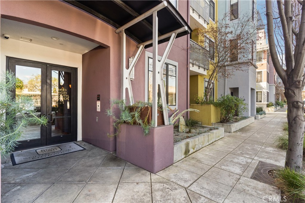 Brownstone Style providing direct access to curb on interior courtyard *Stunning 2 Bedrooms, 2 Full Baths, with high ceilings. 3 feet wide, colonist doors throughout. Oak planked vinyl flooring *Central heating and air conditioning. *1st floor, 1 level, with patio *Granite kitchen, *Viking stainless steel appliances including refrigerator and washer and dryer. *Limestone and natural stone throughout. Subterranean parking with two separate assigned spaces *Great location!!* 1 Block to Whole Foods Market. *Conveniently located and just a few blocks to Cal Train and the coveted University Avenue. Highly coveted Palo Alto school district. AVAILABLE TO SEE BY APPOINTMENT.